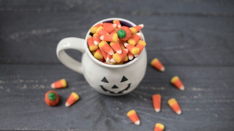 kettle corn in a pumpkin mug for a halloween care package