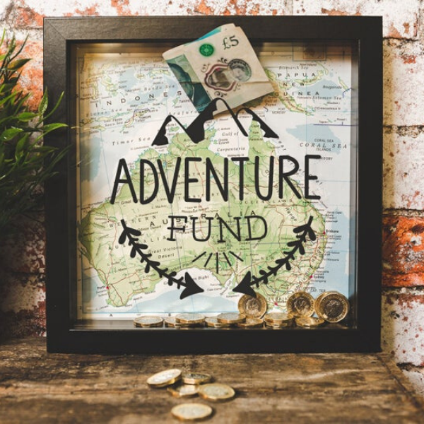 Customizable travel fund box with money inside