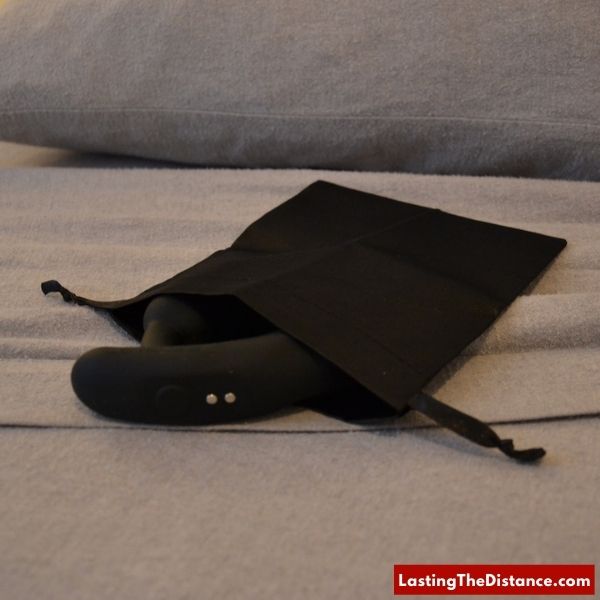 lovense edge 2 in pouch on bed