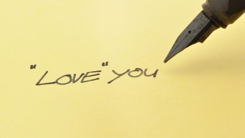 love you written in ink pen