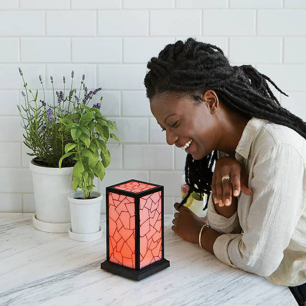 woman looking down at filimin classic friendship lamp