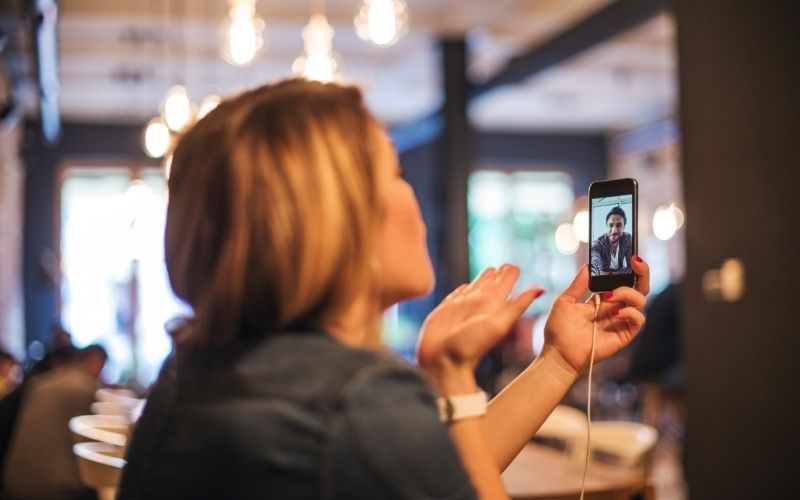 couple looking for sweet things to do in a long distance relationship at a coffee shop