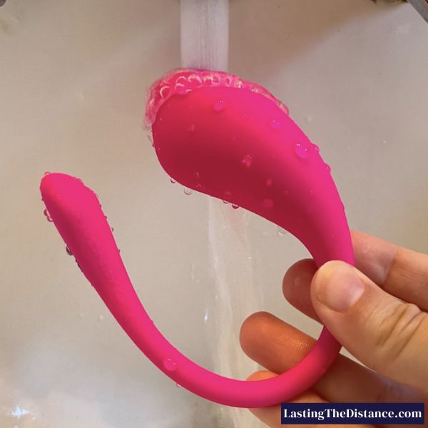 rinsing lovense lush 3 under warm water after cleaning process